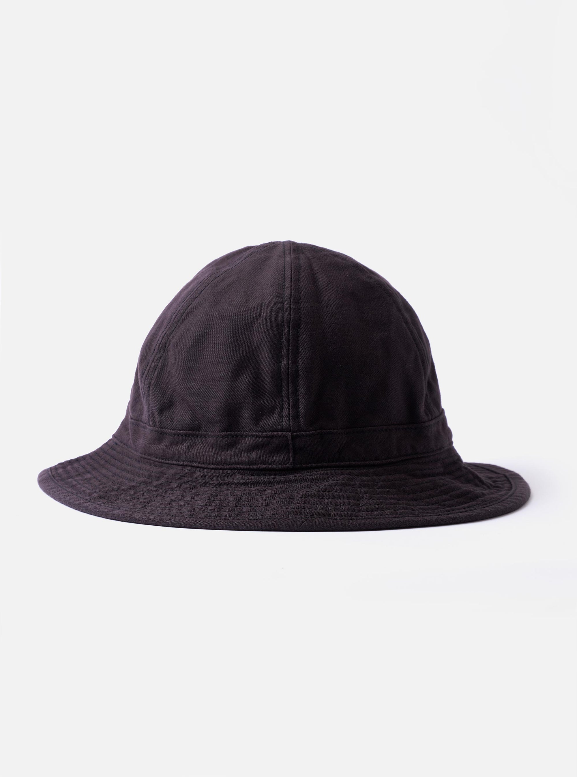 The cableami Black Baker Back Satin Cotton Metro Hat is shown as a flat lay against a white background. The hat is a six-panel bucket style featuring a rounded crown and a downwards-sloping brim with tonal stitching. The black back-satin cotton fabric has a subtle, textured appearance.