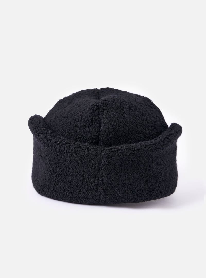 cableami® Black Recycled Wool Flight Watch Cap on a white background. The cap is made of black, textured wool and has a unique, rounded shape.