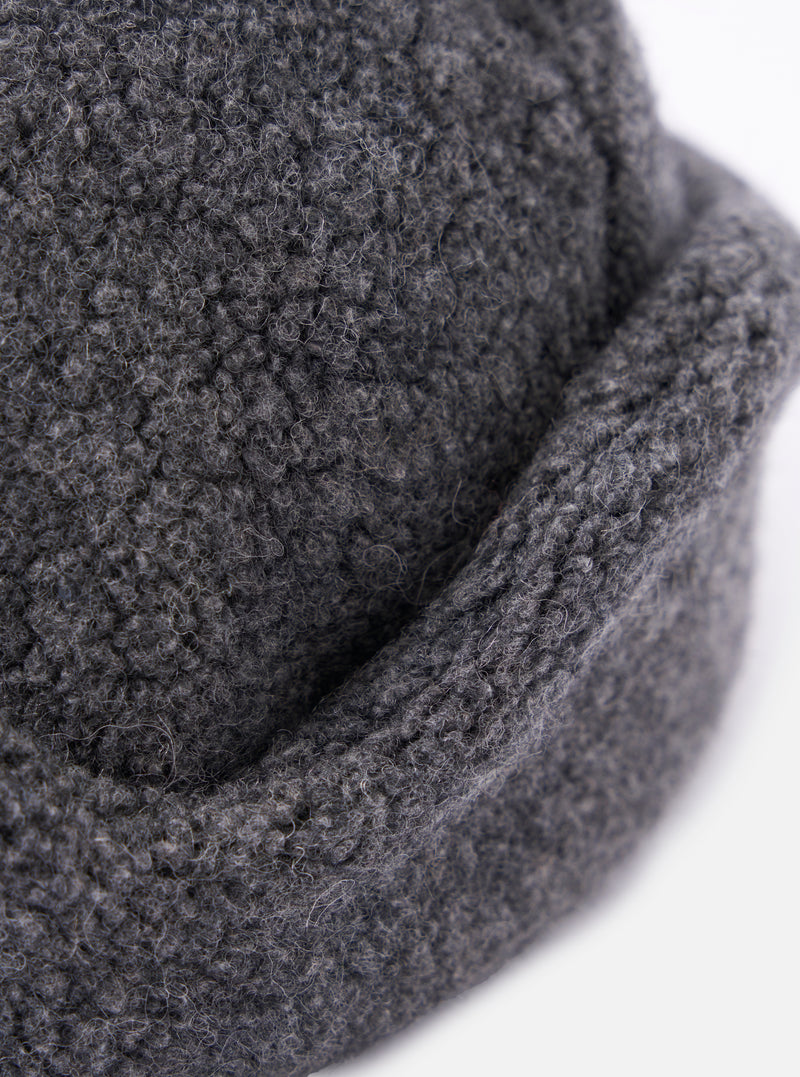 Close-up of the cableami® Grey Recycled Wool Flight Watch Cap showing the texture and construction of the grey wool material. Shot on a white background.