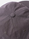The cableami Grey/Olive Cotton/Nylon B.B Cap is shown in a side-profile view as a flat lay against a plain white background. The image highlights the six-panel construction, the curved brim in a contrasting olive green, and the grey crown. An adjustable leather strap with a metal buckle is visible at the back.