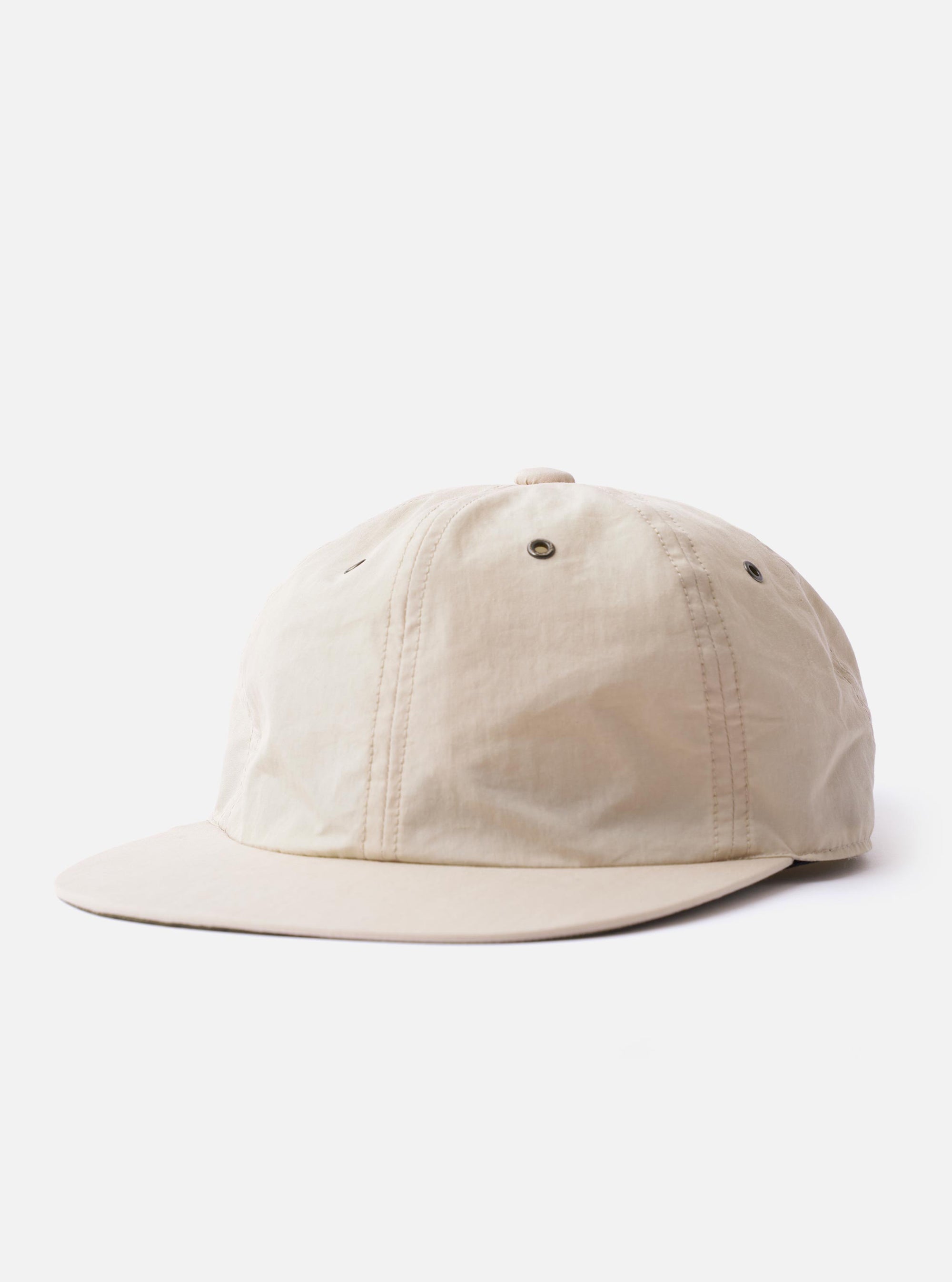 The cableami Ivory/Olive Cotton/Nylon B.B Cap is shown as a flat lay against a plain white background. The baseball cap features a two-tone design with an ivory crown and a contrasting olive green curved brim. It includes a button at the top and embroidered ventilation eyelets.