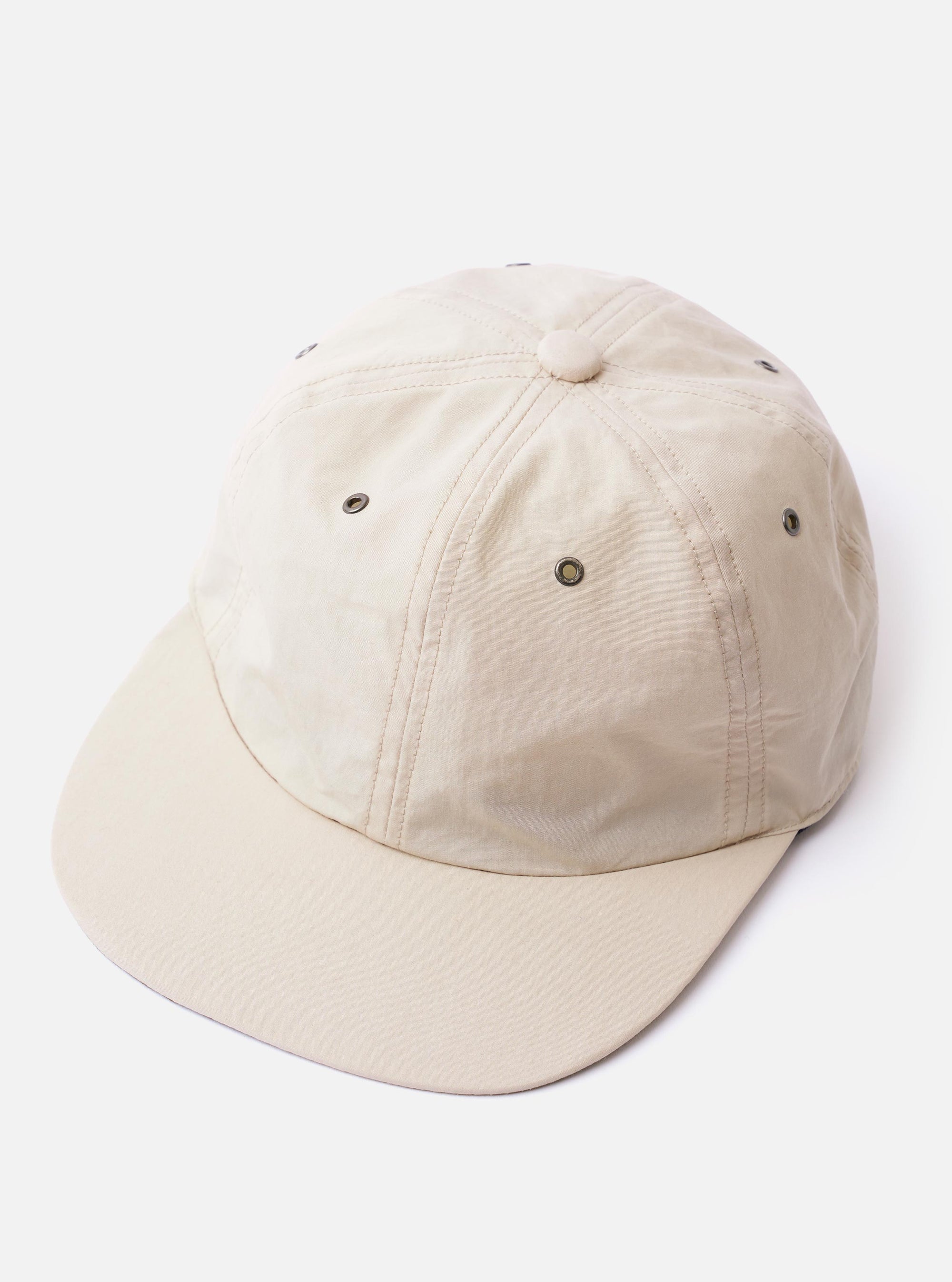 The cableami Ivory/Olive Cotton/Nylon B.B Cap is shown from the back as a flat lay against a plain white background. The image highlights the adjustable brown leather strap with a metal buckle and the ivory-colored cotton/nylon crown.