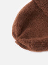 Close-up of a cableami® Brown Mohair Watch Cap on a white background. The soft, textured knit of the cap is clearly visible, showcasing its warm brown color and comfortable fit.