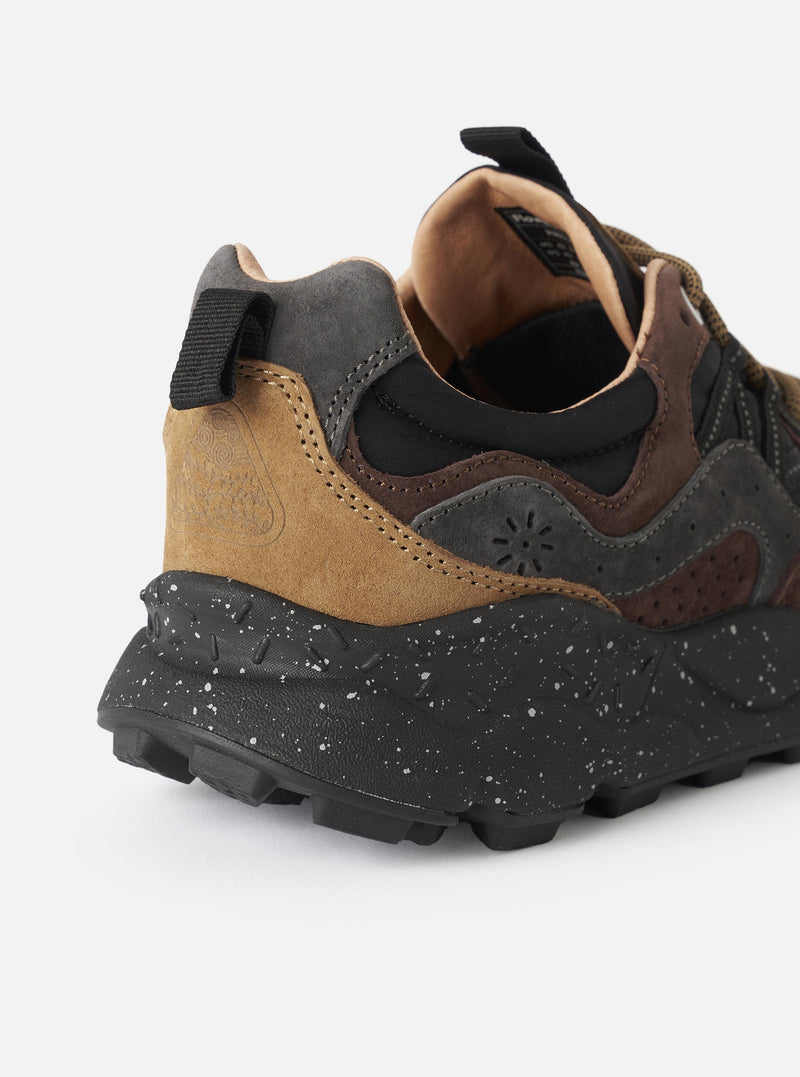 Rear angle view of the Flower Mountain Dark Grey/Black/Dark Brown Suede/Nylon Yamano 3 Man sneaker on a plain white background. The image highlights the dark brown leather heel pull tab, sturdy heel counter support, and thick treaded outsole.