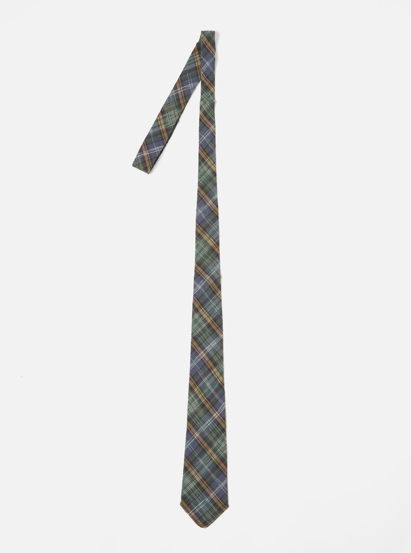 The Green Ikat Twill Check Tie is displayed on a white background. The tie features a green, blue, and gold check pattern.