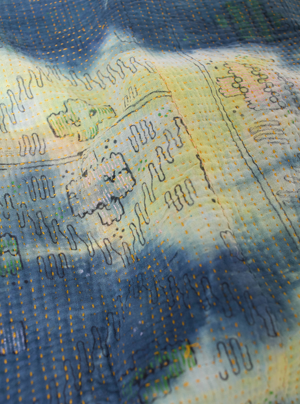 Close-up of the Indigo Tie Dye #2 Kantha Kyoto Work Jacket - Medium. Shows the blue tie dye pattern, kantha stitching, and soft fabric texture.