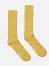 Studio shot of Yellow Slub Knit Slub Sock. The socks are yellow with a slub knit texture, displayed on a white background.