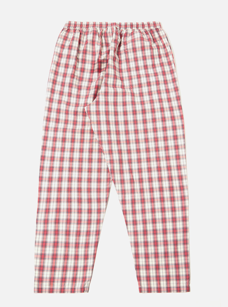 The red cotton check pyjama pant is laid flat on a white background. The relaxed-fit pants feature a red and white plaid pattern and an elastic waistband.