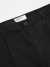 Close-up of the Black Twill Duke Pant on a clean white surface. The twill fabric is visible, showcasing the texture and fit around the waist with a button closure.