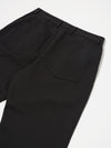 Close-up of the back of the Black Twill Duke Pant on a white background. The pants have a relaxed fit and visible back pockets.