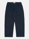The Navy Twill Duke Pant, a relaxed fit in dark blue twill, is displayed on a white background. The pants are neatly folded, showcasing their pleats and pockets.