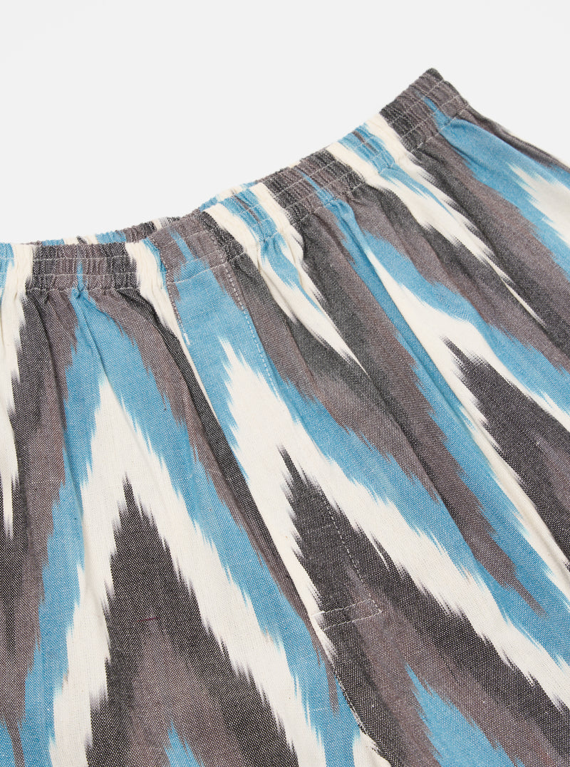 Close-up of Ecru Ikat II Cotton Boxer Short on a white background. The shorts feature a blue, gray, and white ikat pattern and an elastic waistband.