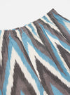 Close-up of Ecru Ikat II Cotton Boxer Short on a white background. The shorts feature a blue, gray, and white ikat pattern and an elastic waistband.