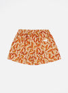 The Terracotta Artist Flower Lincot Boxer Short, featuring a terracotta and beige floral pattern, is laid flat on a white background. The shorts have an elastic waistband.