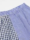 Close-up of Blue Gingham Mix Pyjama Short on a white background. The shorts feature a blue and white checkered pattern and an elastic waistband.