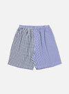 On a white background, a pair of Blue Gingham Mix Pyjama Short. The shorts are made of blue and white gingham fabric, with an elastic waistband.
