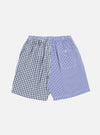 The Blue Gingham Mix Pyjama Short, featuring navy and light blue gingham patterns, is laid on a white background. The shorts have an elastic waist and a relaxed fit.