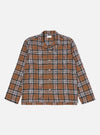 Flat lay of the Brown Ikat Twill Check Long Pyjama Set top on a white background. The top is brown with a black, white, and red check pattern.