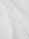 Close-up of the White Oxford Daybrook Shirt, showcasing the crisp white fabric, button-down style, and clean design. Shot on a flat, neutral surface.