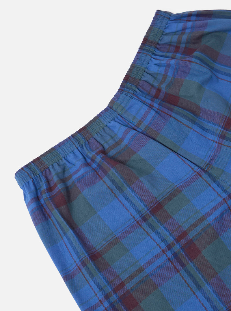 Close-up of Multi Kip Check 3 Pack Boxer Short. Blue, green, and maroon plaid pattern. Elastic waistband. Cotton material. Shot on a white background.