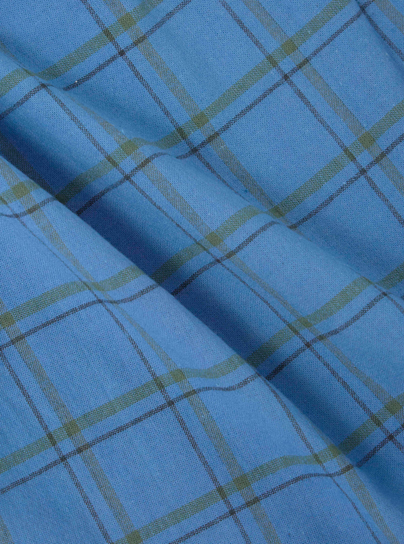 Close-up of blue plaid fabric, part of the Multi PJ Plaid 3 Pack Boxer Short collection. Soft cotton material with green and black lines. Shot on a flat surface.