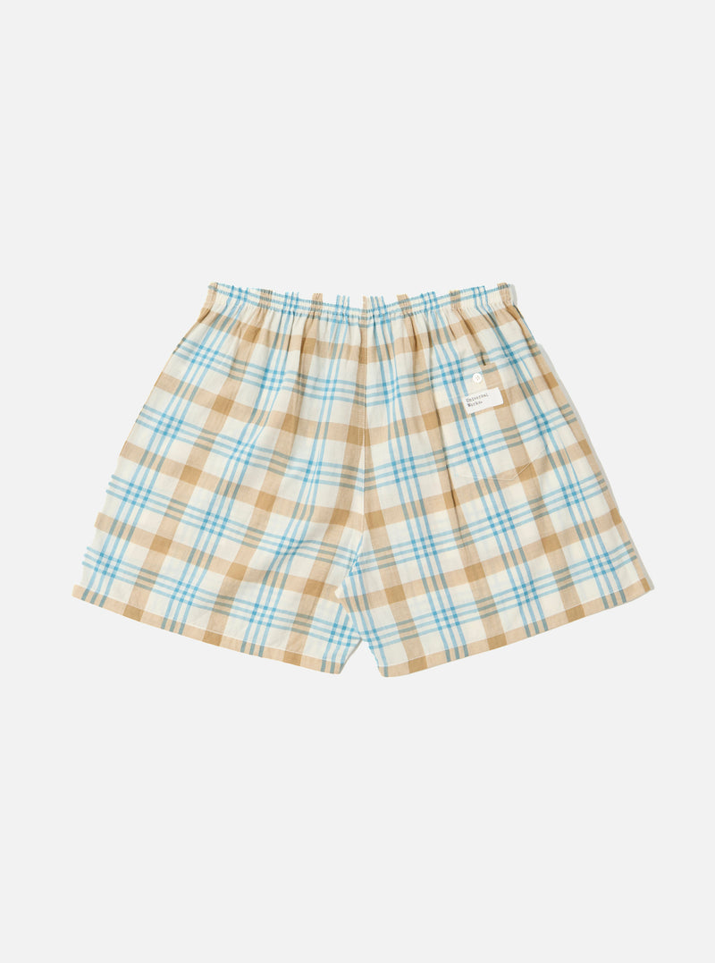 The Ecru Madras Check Boxer Short on a white background. The shorts are ecru with a blue and tan check pattern. They have an elastic waistband.