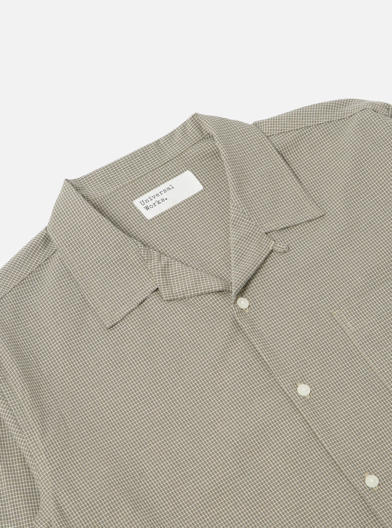 Close-up of the Green Tiny Check Long Pyjama Set top. The shirt is neatly folded on a white surface, showcasing its tiny green check pattern and relaxed fit.