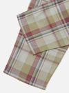 Close-up of the Green Kip Check Long Pyjama Set fabric. Soft, brushed cotton in a classic plaid pattern with green, red, and blue on a cream background. 