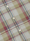 Close-up of the Green Kip Check Long Pyjama Set. The fabric is a soft, brushed cotton with a classic check pattern in green, red, and blue. White buttons are visible.