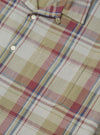 Close-up of the Green Kip Check Long Pyjama Set. The fabric is a soft, brushed cotton with a green, red, and blue plaid pattern. Features a button-down top with a chest pocket.