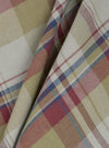 Close-up of the Green Kip Check Long Pyjama Set fabric. The material is a soft, brushed cotton with a green, red, and blue plaid pattern.