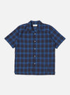 Close-up of the Navy/Blue Check Short Pyjama Set top on a white background. The short-sleeved shirt features a navy and blue check pattern and a button-down front.