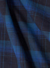 Close up of the Navy/Blue Check Short Pyjama Set fabric. The material is folded, showing the navy and blue check pattern.