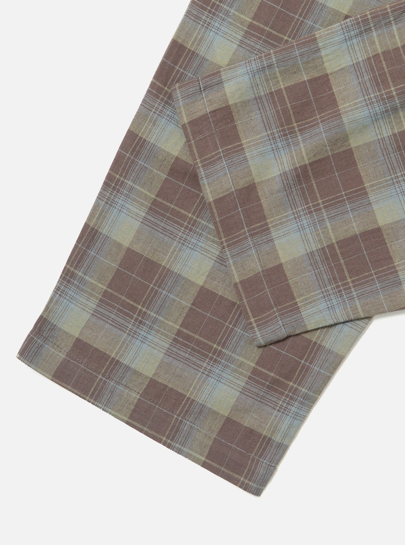 Close-up of the Green/Brown Check Pyjama Pant on a white surface. The fabric features a classic plaid pattern with green, brown, and light blue hues.