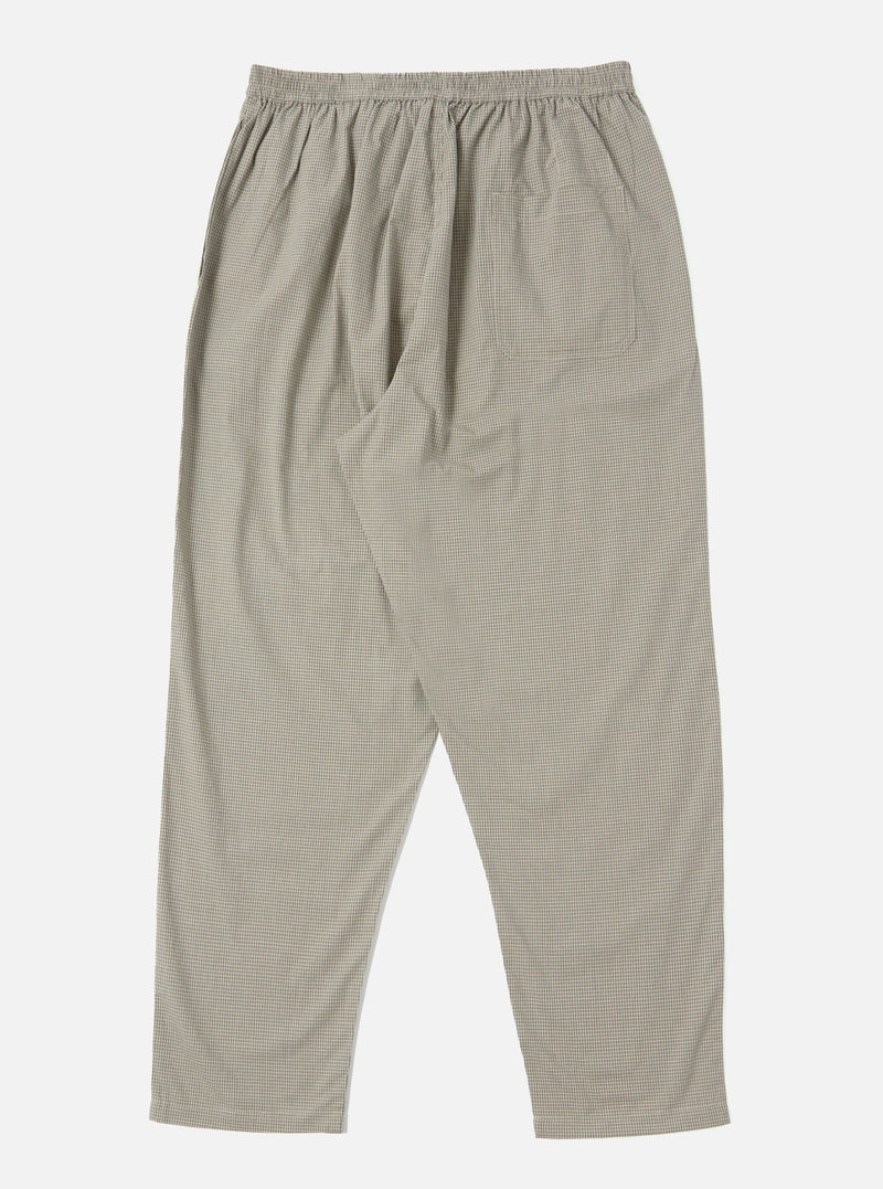 The Green Tiny Check Pyjama Pant on a white background. The pants have a relaxed fit and an elastic waistband. The fabric is a tiny green and white check pattern.