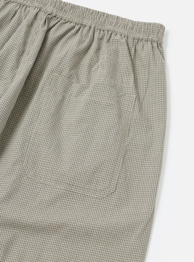 Close-up of the Green Tiny Check Pyjama Pant on a white background, showing the elastic waistband and pocket detail. The fabric has a small green and white check pattern.