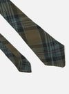 Close-up of the Brown/Charcoal Ikat Twill Check Tie on a white background. The tie features a brown and charcoal plaid pattern.