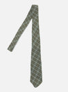 The Green Picnic Plaid Tie is displayed on a white background. The tie has a green, brown, and blue plaid pattern.