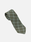 The Green Picnic Plaid Tie is displayed on a white background. The tie has a green, gold, and blue plaid pattern.