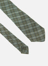 Close-up of the Green Picnic Plaid Tie on a white background. The tie features a green, blue, and brown plaid pattern.