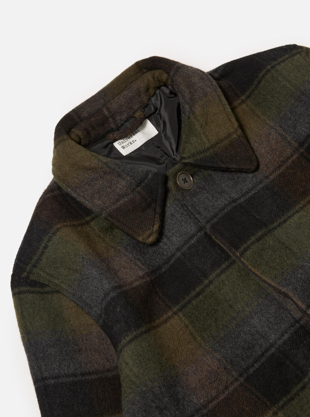 Close-up of the Black/Brown Berlin Wool Check Account Coat on a white background. The wool coat features a black lining and a button closure.