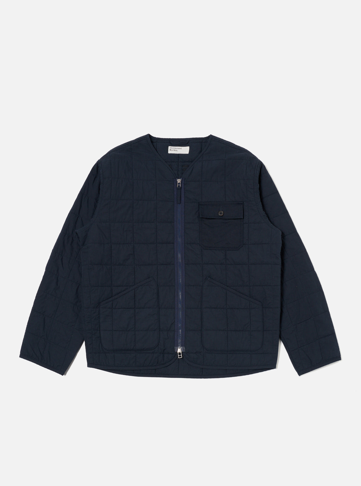 The Navy Quilt Cotton Military Liner Jacket is displayed on a white background. The jacket is a dark navy blue and has a quilted pattern. It features a zip-up front and pockets.