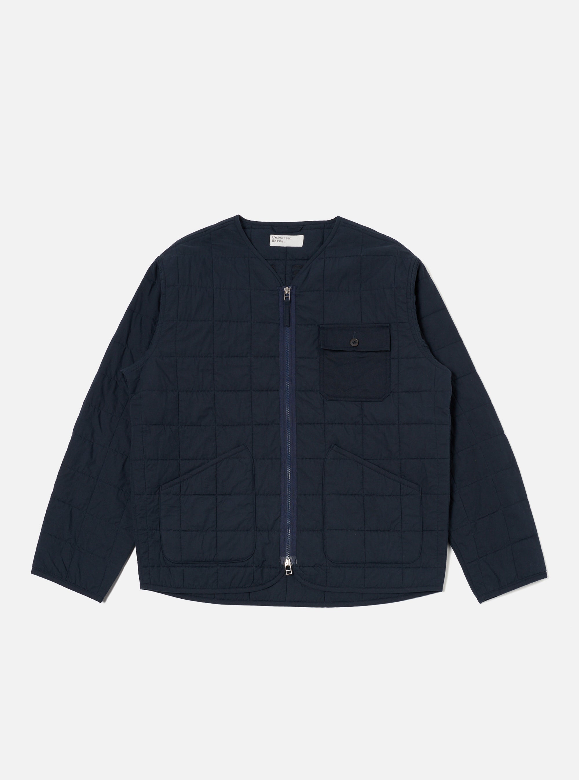 The Navy Quilt Cotton Military Liner Jacket is displayed on a white background. The jacket is a dark navy blue and has a quilted pattern. It features a zip-up front and pockets.