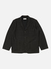Studio shot of a Black Salt N Pepper Tweed Three Button Jacket laid flat on a white background. The tweed jacket has a classic fit and visible front pockets.