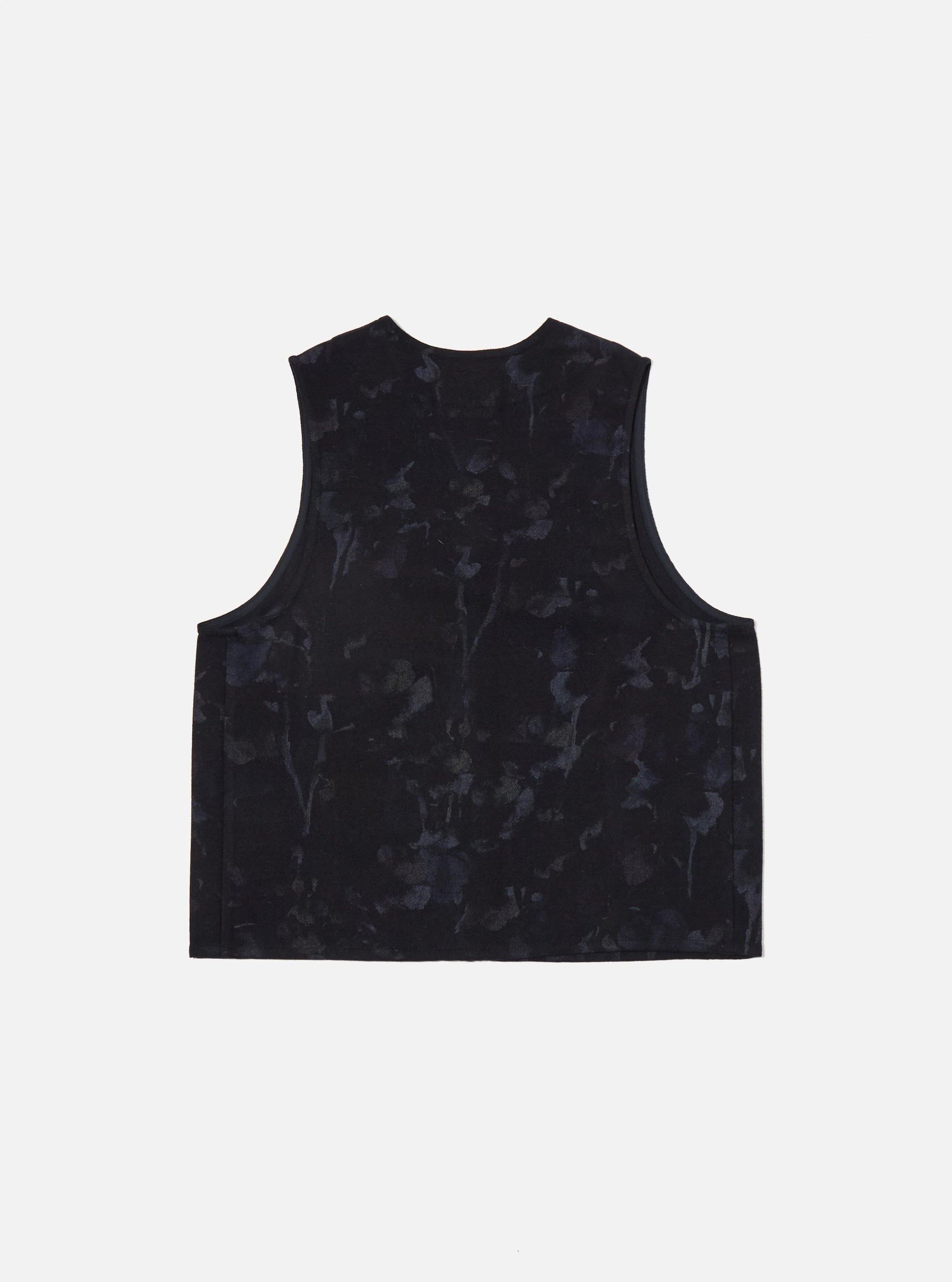 The Navy Flower Print Flannel Operators Gilet, in a flat lay on a white background. The gilet is dark navy with a subtle floral print.
