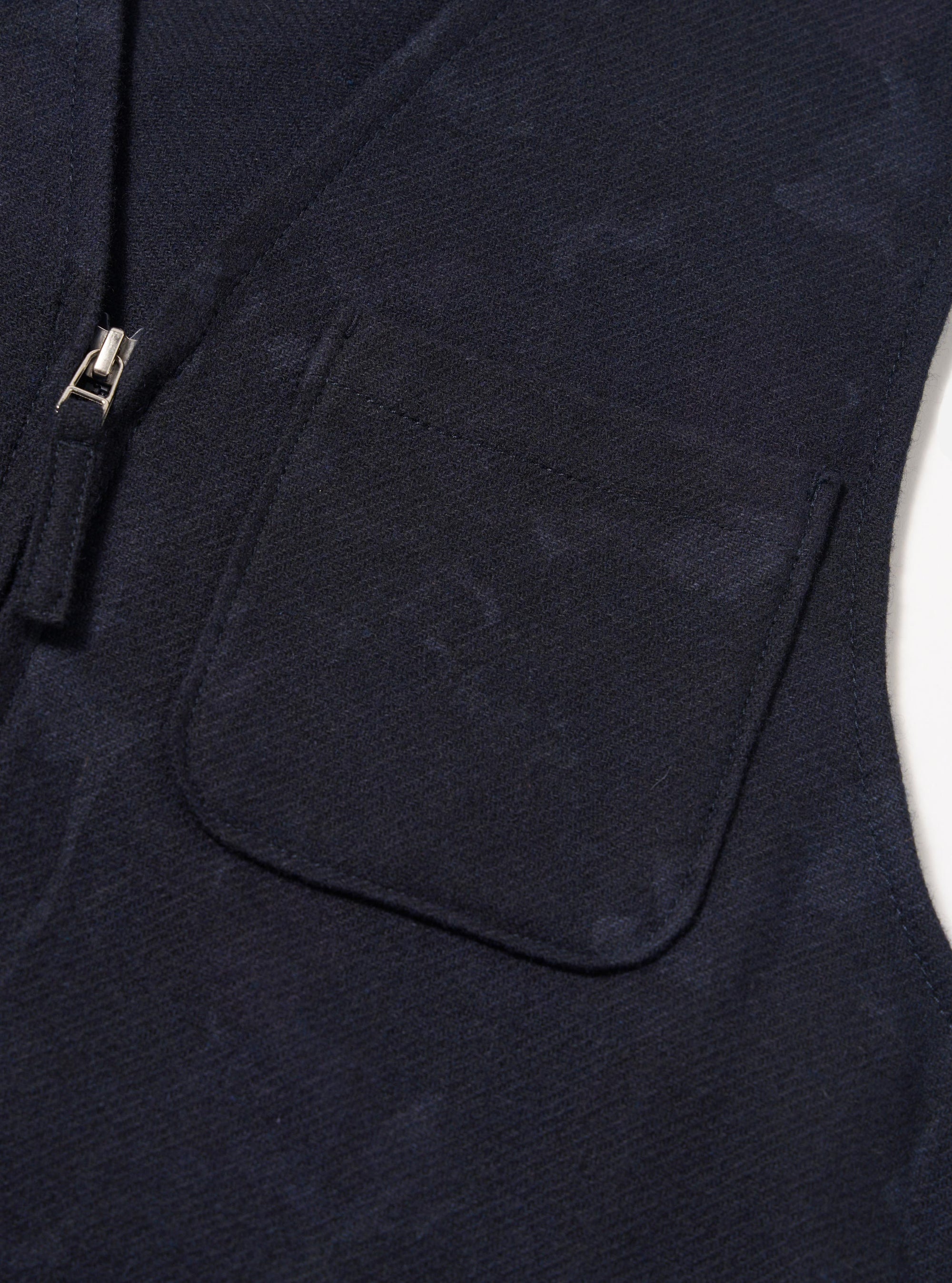 Close-up of the Navy Flower Print Flannel Operators Gilet, showcasing the navy flannel material, floral print, zip and pocket detail against a plain white background.