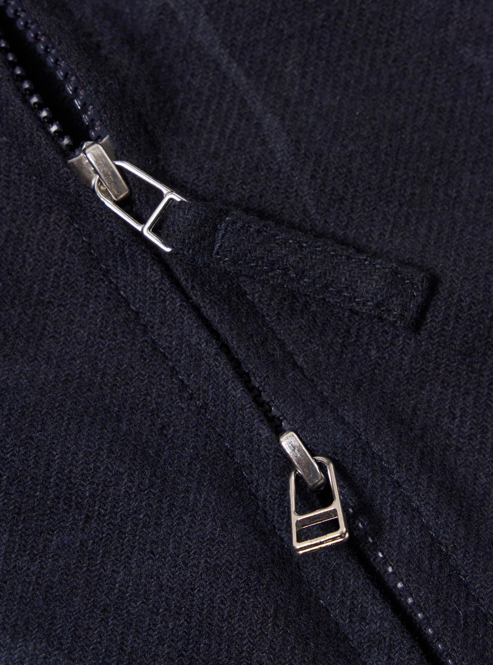 Close up of the zipper on the Navy Flower Print Flannel Operators Gilet. The flannel is a dark navy color. The zipper is silver.