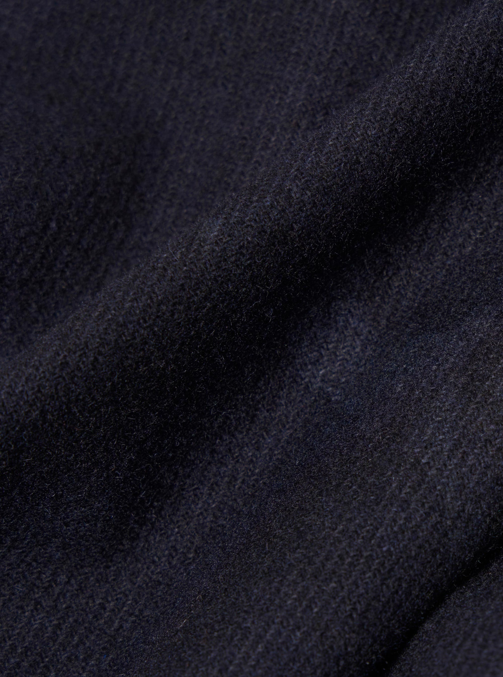 Close-up of the Navy Flower Print Flannel Operators Gilet, showing the soft, textured flannel fabric in a deep navy hue with subtle floral print detailing.