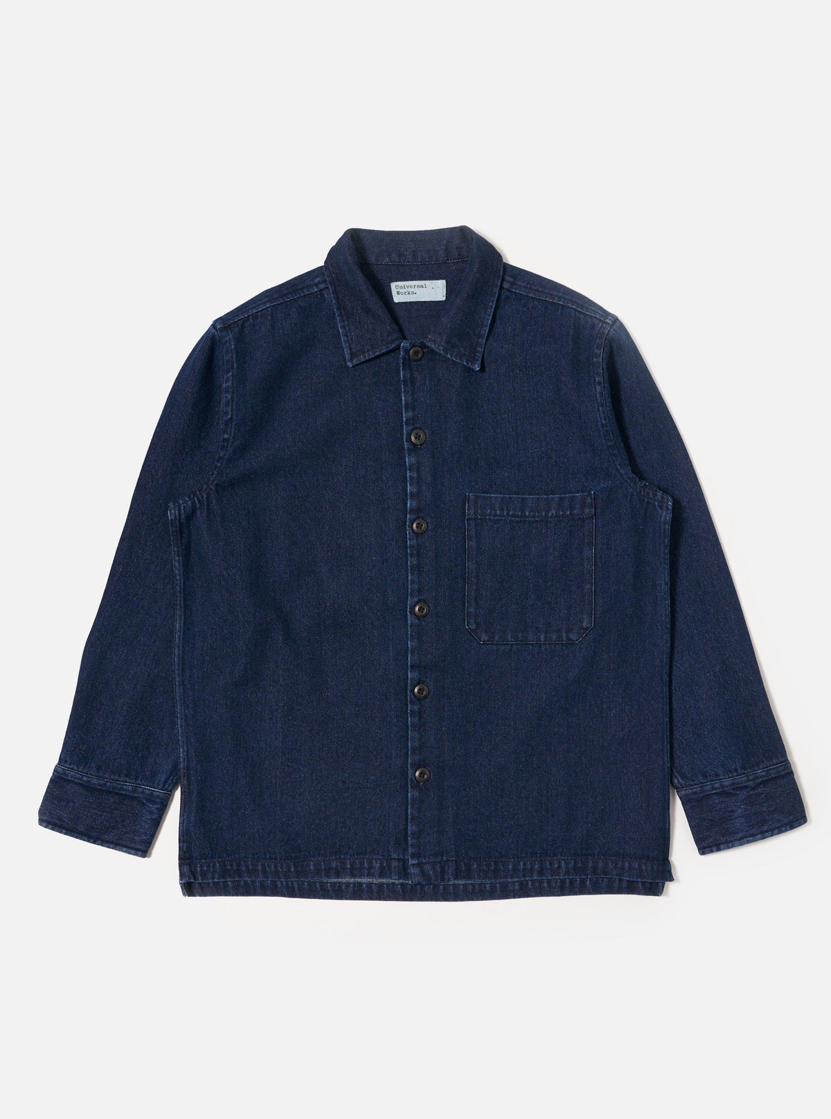 The Indigo Work Denim Fatigue Shirt is displayed on a white background. The shirt is a dark indigo color and has a button-down front and a single chest pocket.