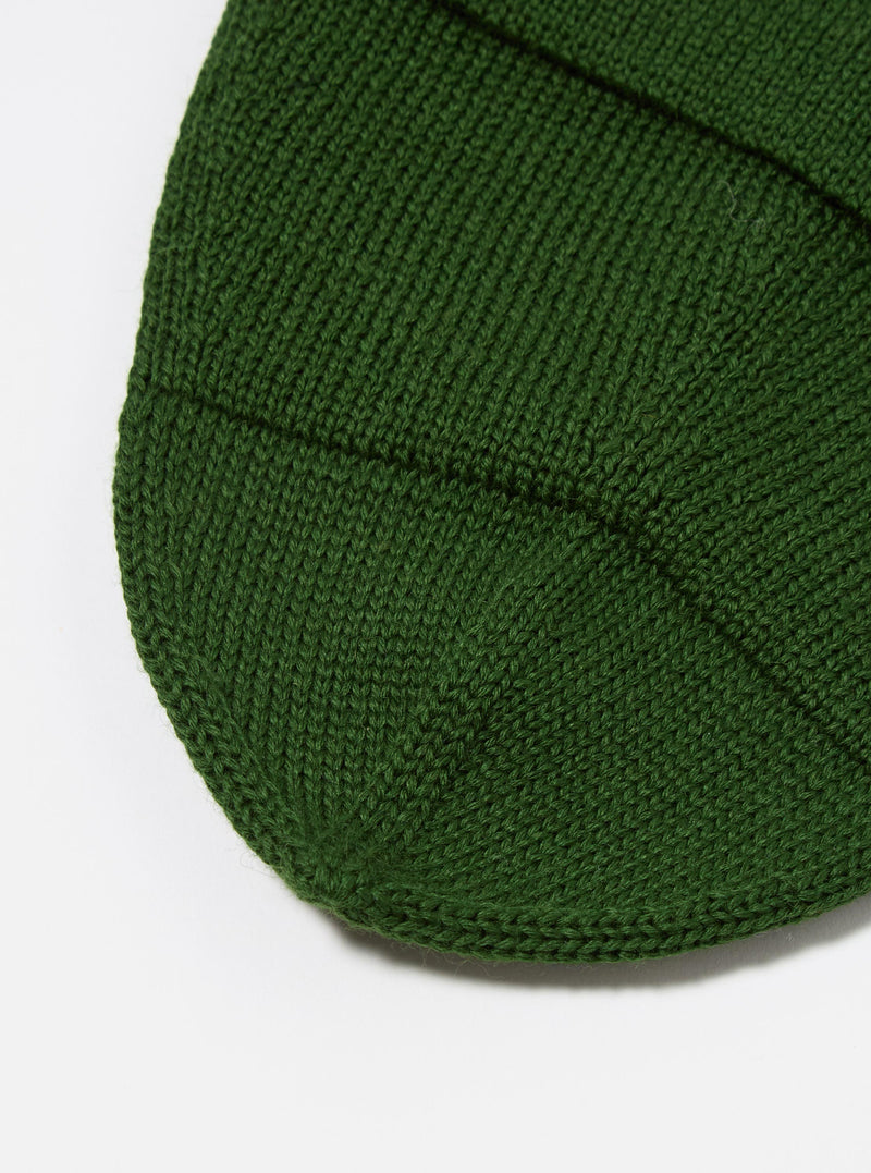 Close-up of the Green Merino Knit Watch Cap, showcasing the texture of the knit on a white background.